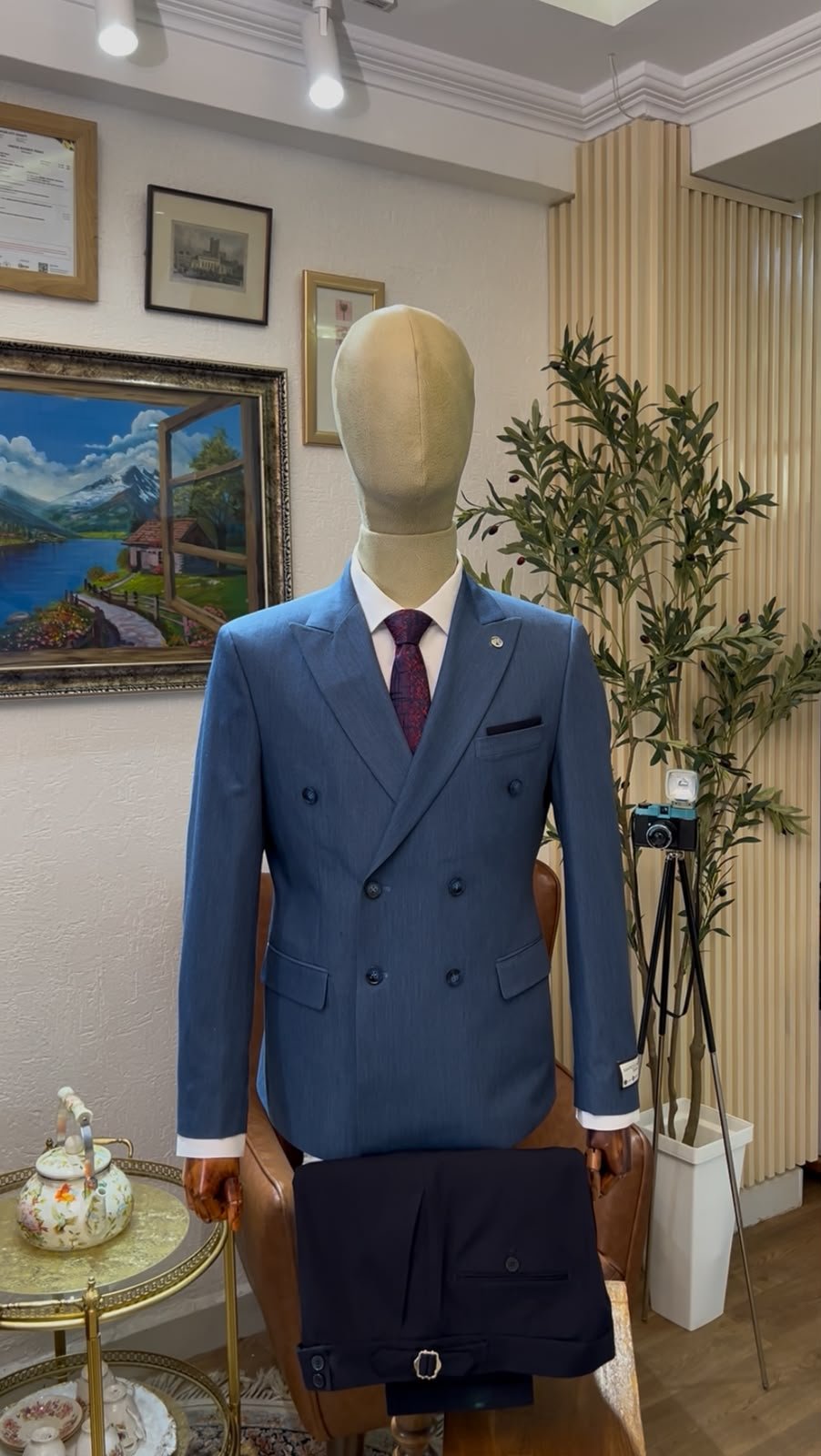 Blue double-breasted blazer displayed on a mannequin